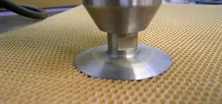 Knife cutting honeycomb
